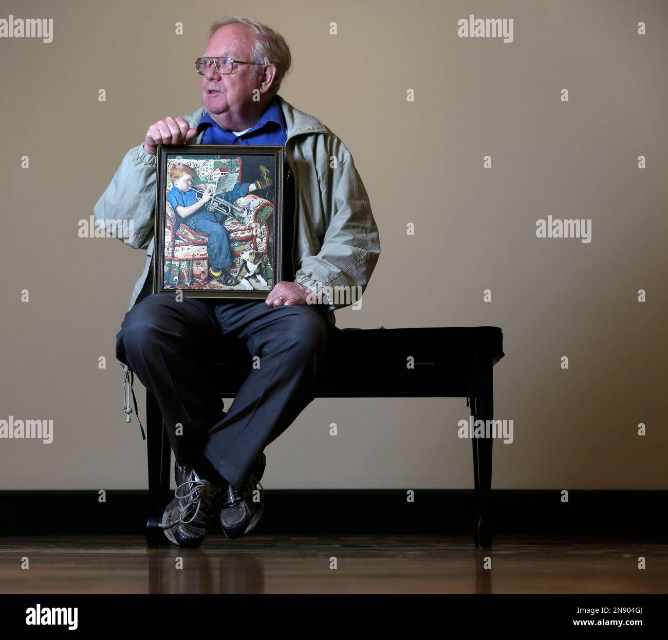 tom-paquin-of-north-bennington-vt-poses-with-a1950-saturday-evening-post-illustration-by-norman-rockwell-for-which-he-modeled-at-the-bennington-museum-on-friday-sept-28-2012-in-bennington-vt-ap-photomike-groll-2N904GJ