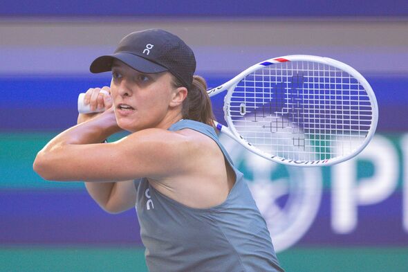 iga-swiatek-of-poland-competes-against-magda-linette-of-poland-during-their-first-round-match-6813952 1