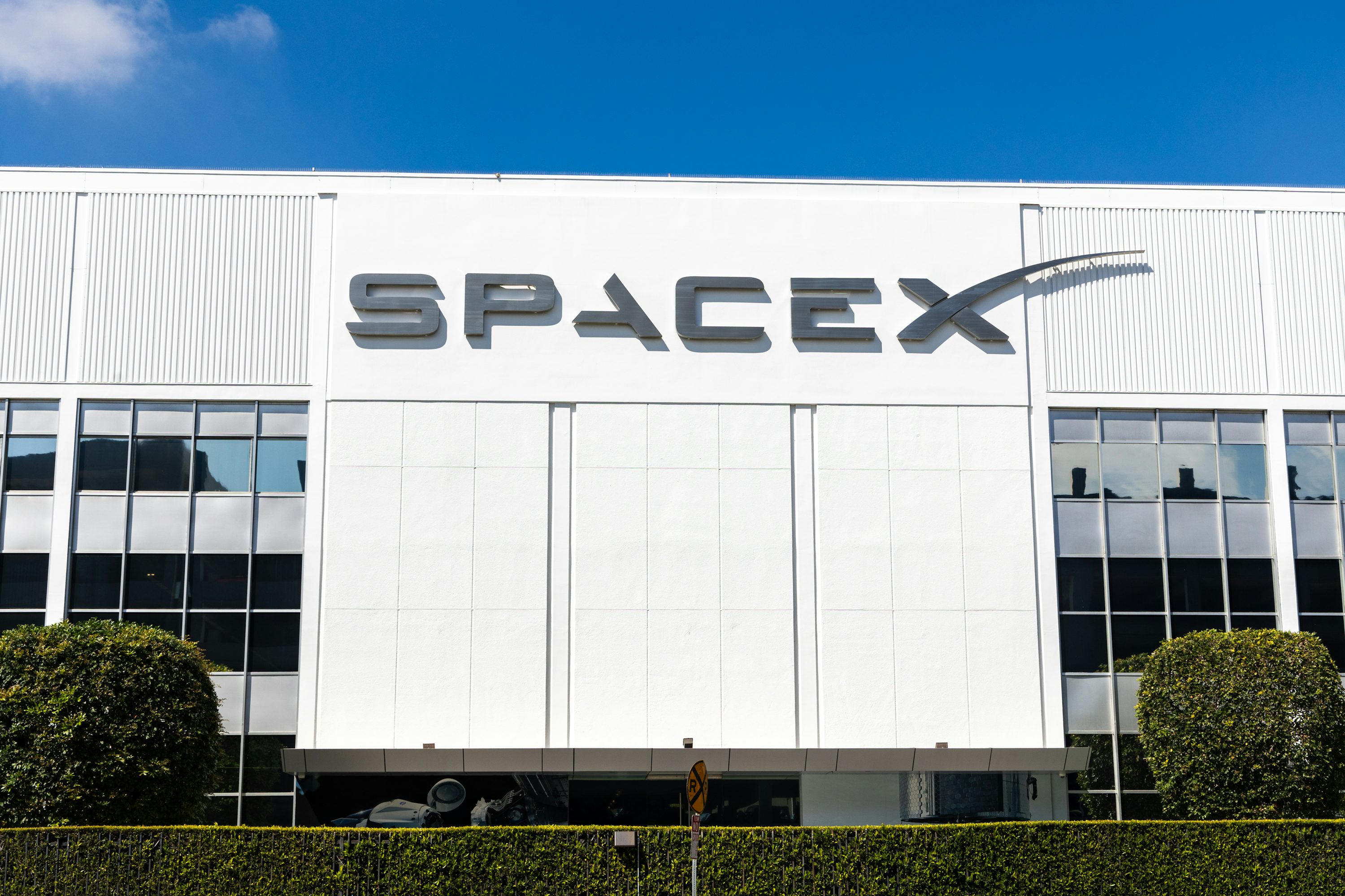 A building with a sign that says spacex on it photo – Free...
